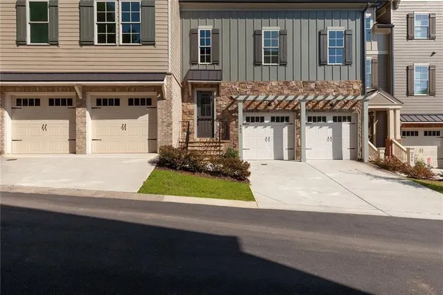 a view of empty room with wooden floor and window