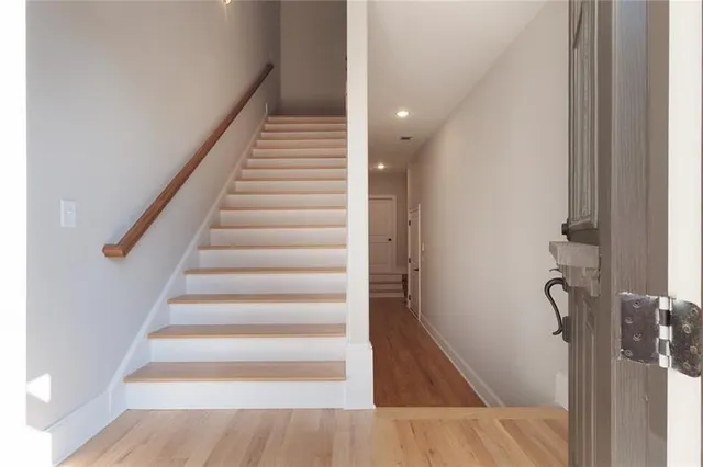 a view of a room a window and wooden floor