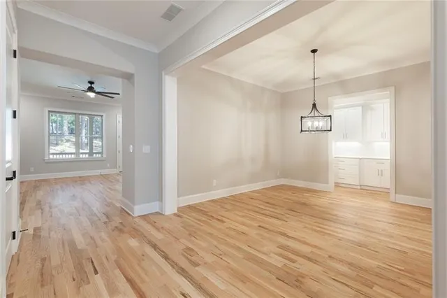 a view of kitchen with cabinets and wooden floor