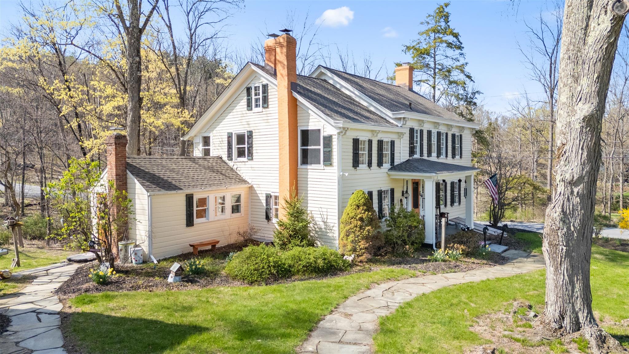 124 East Ridge Road Warwick, NY 10990 - Photo 16 of 46 a front view of a house with garden