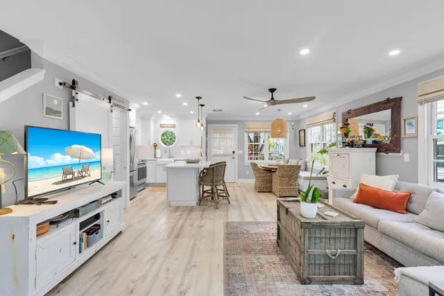 a living room with furniture and a flat screen tv