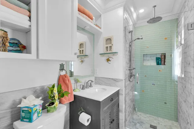 a bathroom with a sink mirror and vanity