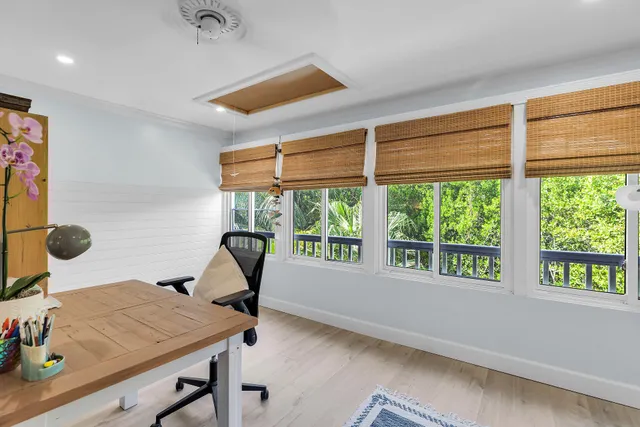 a workspace with furniture and a window