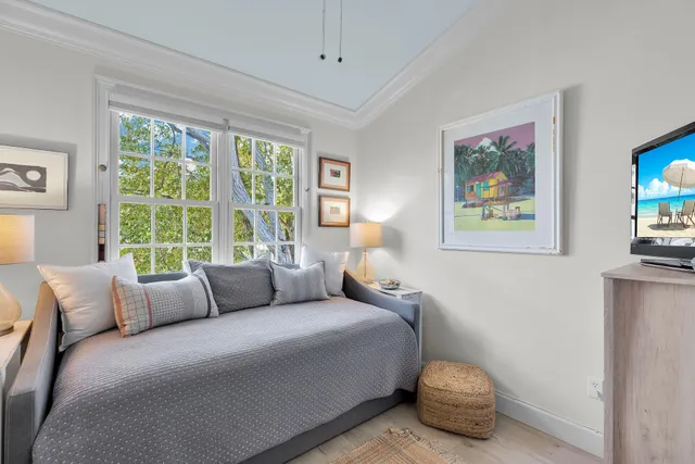 a bedroom with bed and a window