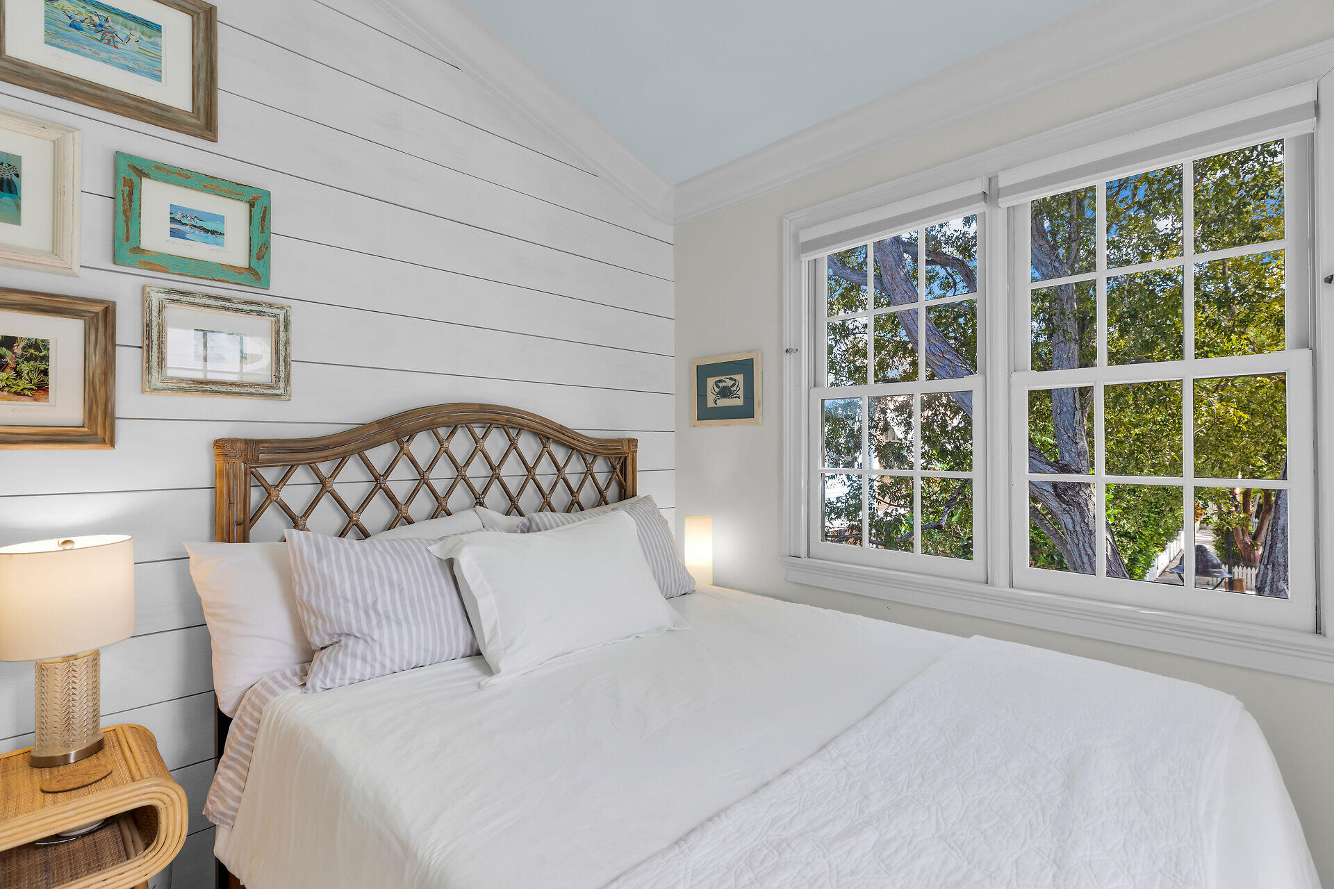 21 Whistling Duck Lane Key West, FL 33040 - Photo 35 of 45 a bedroom with a large bed and a large window