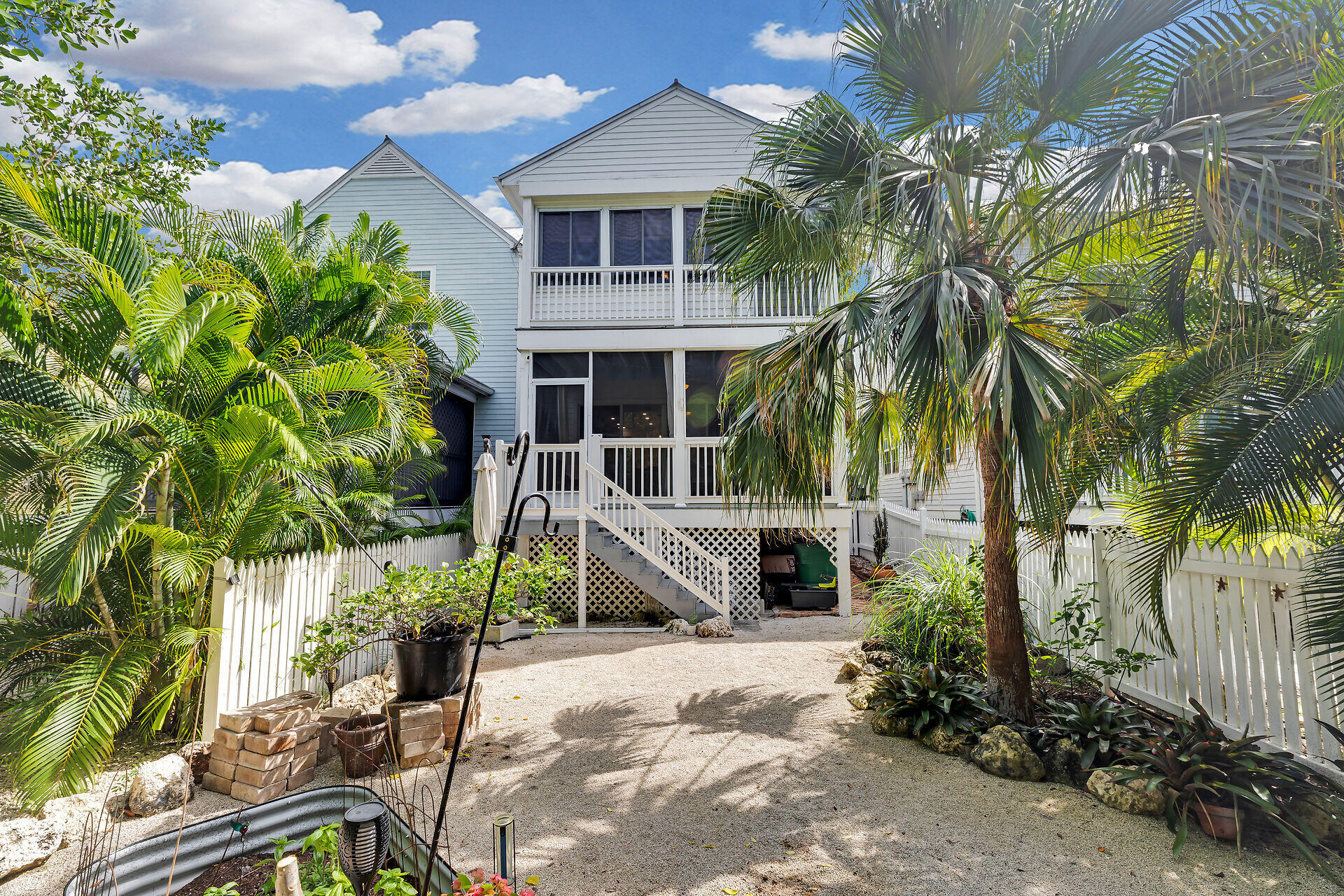 21 Whistling Duck Lane Key West, FL 33040 - Photo 39 of 45 a front view of a house with a yard