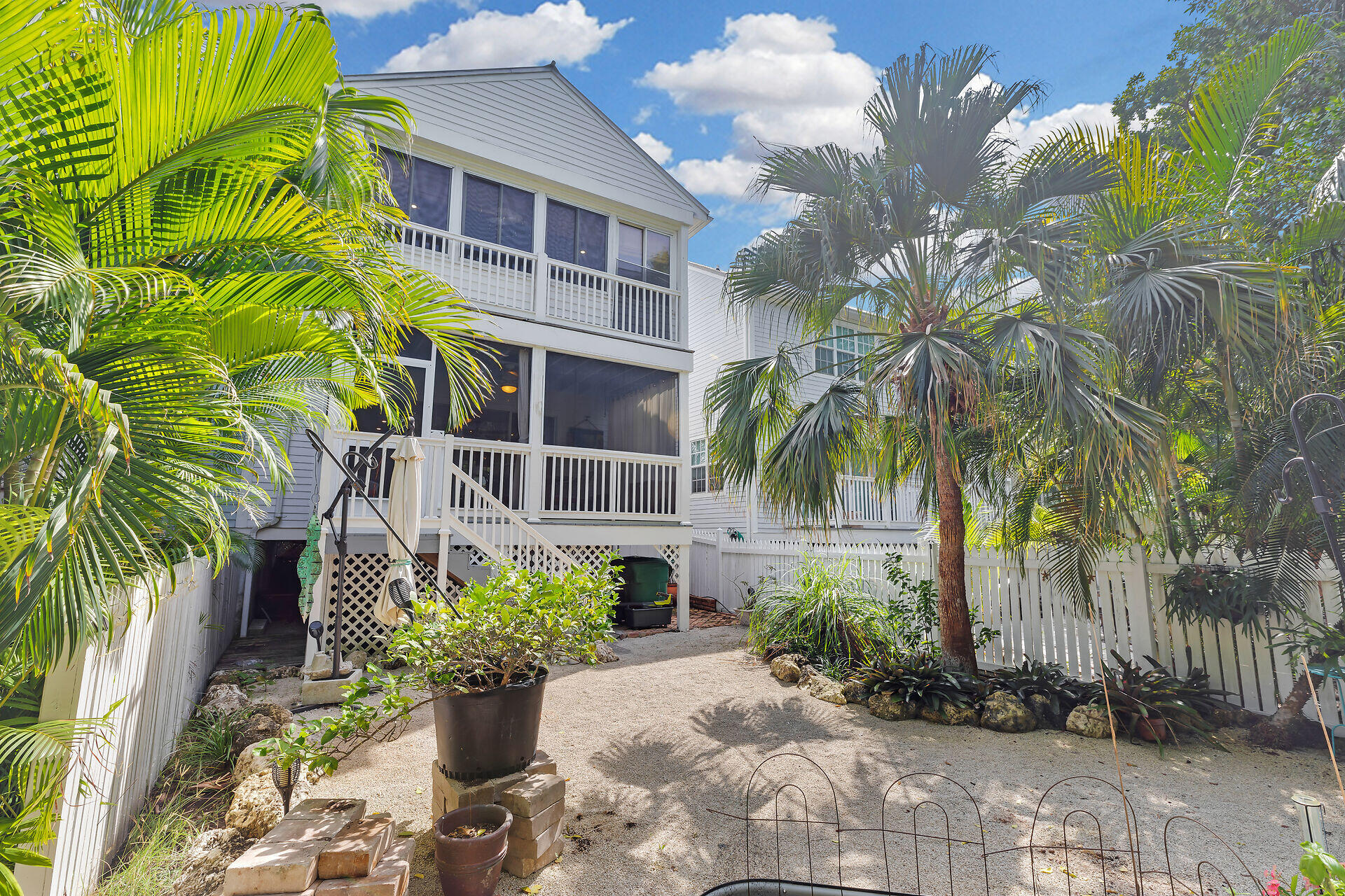 21 Whistling Duck Lane Key West, FL 33040 - Photo 40 of 45 a front view of a house with a garden