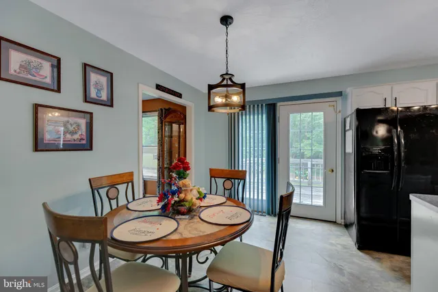 a bathroom with a sink a toilet and shower curtain