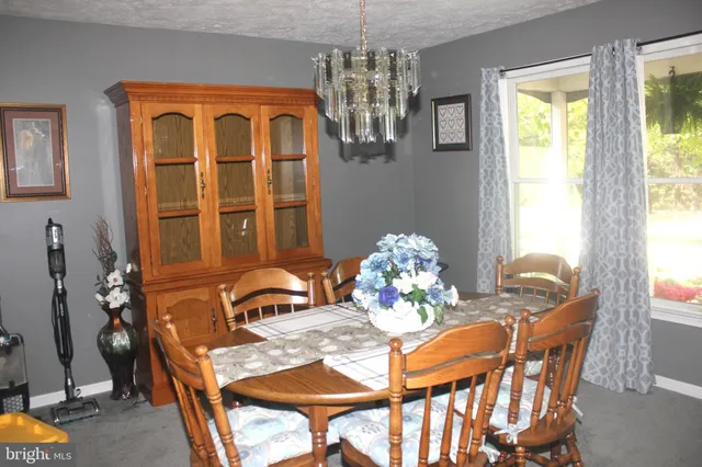 a view of a room with rack and a fan