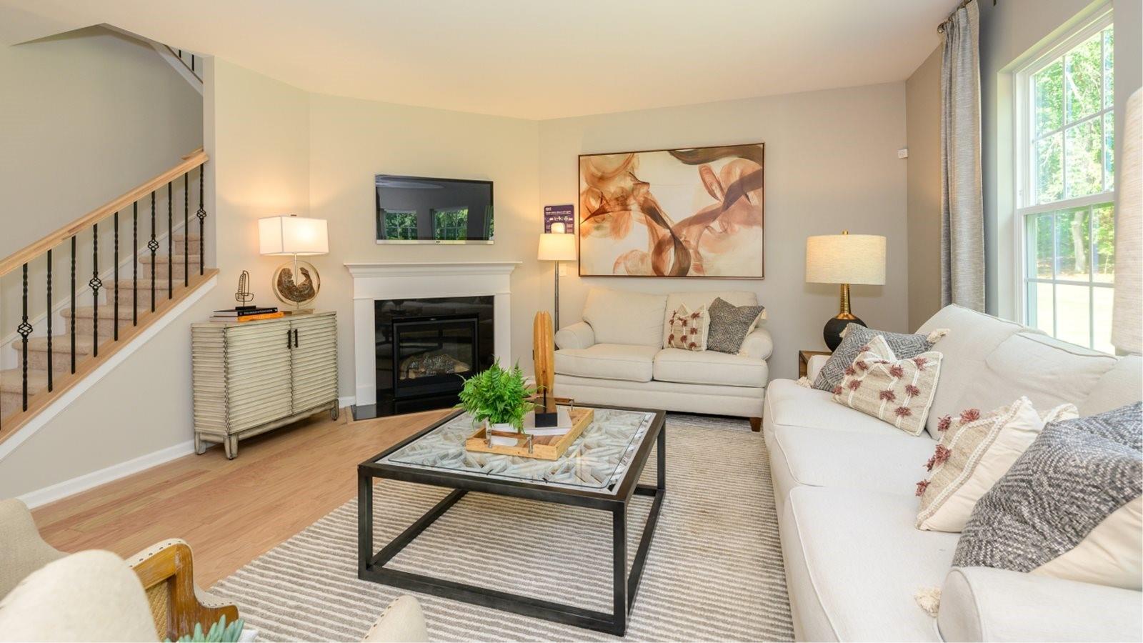 1767 Loggerhead Drive, Unit 17 Lancaster, SC 29720 - Photo 3 of 13 a living room with furniture a rug and a fireplace
