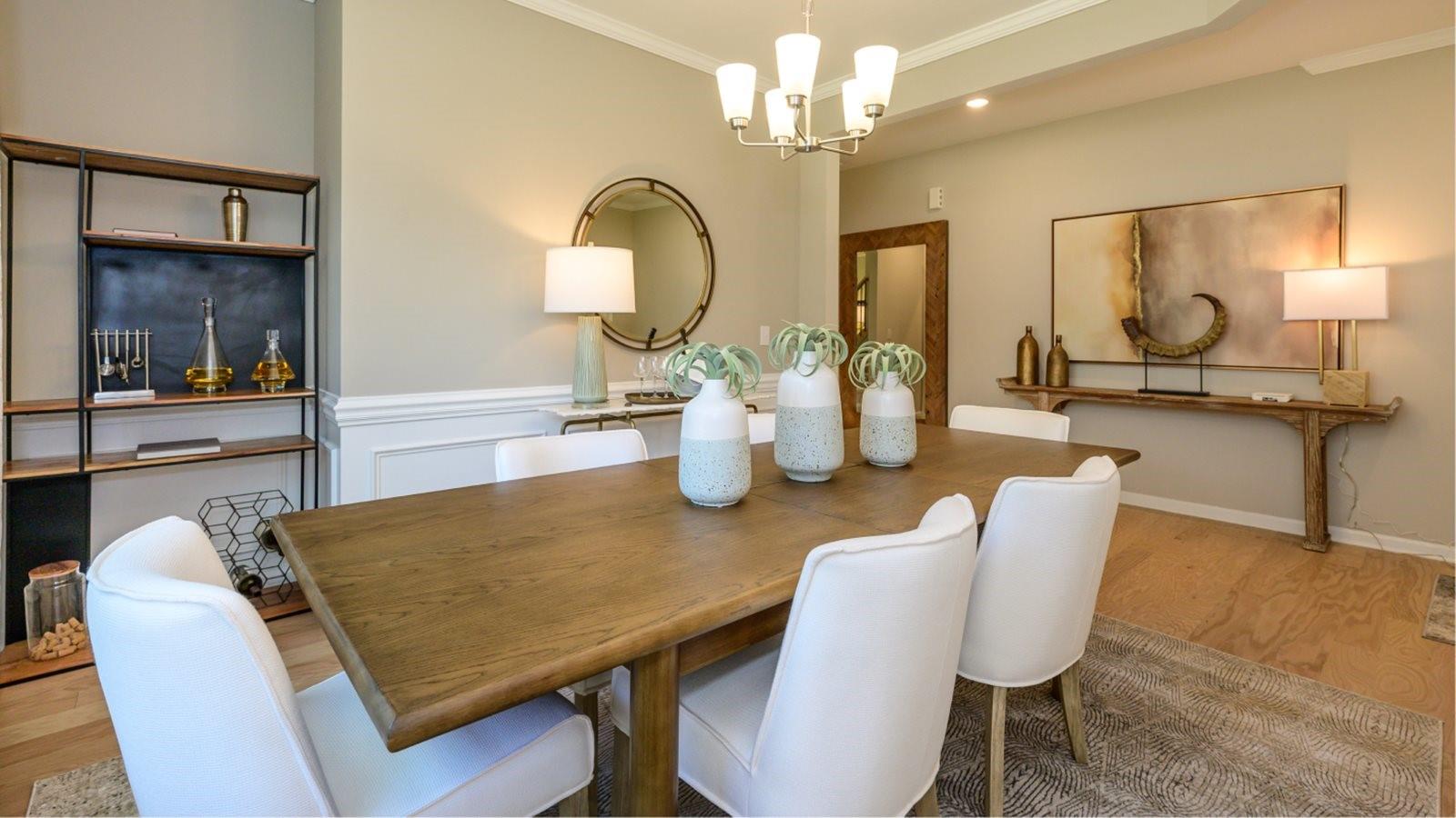 1767 Loggerhead Drive, Unit 17 Lancaster, SC 29720 - Photo 5 of 13 a view of a dining room with furniture a chandelier and wooden floor
