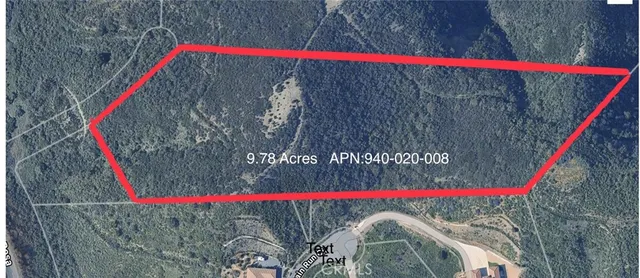 a view of a large mountain with mountains in the background