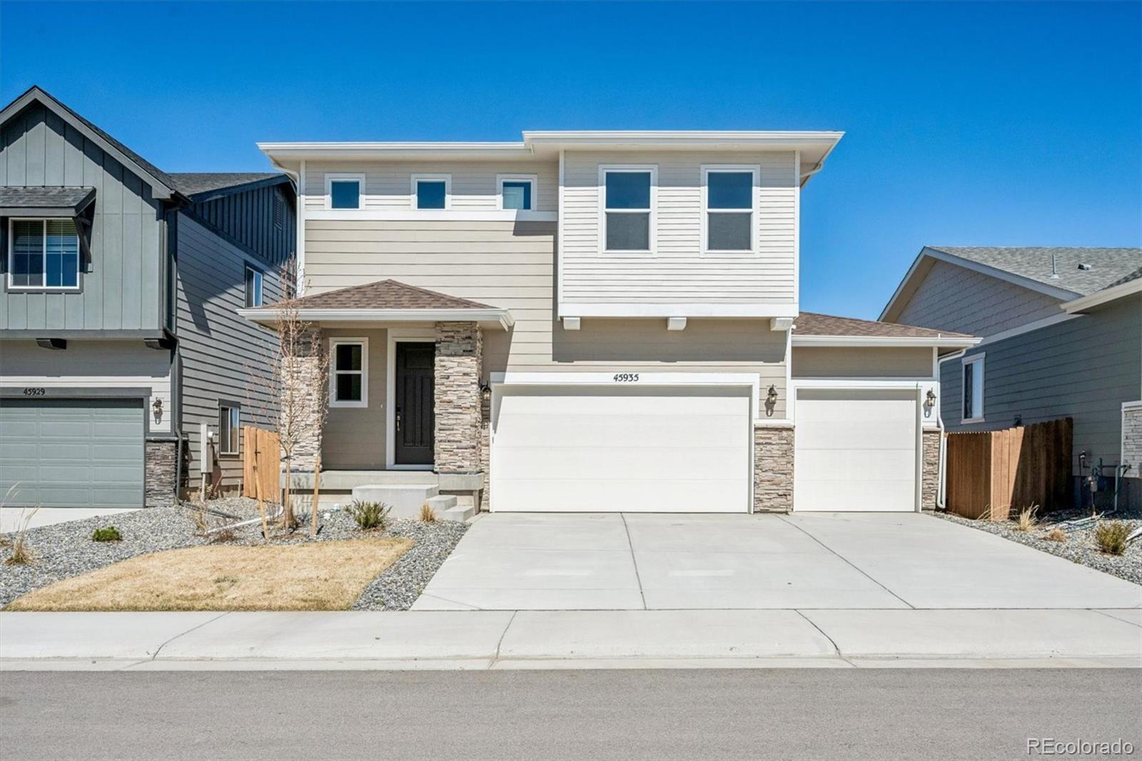 45935 Gentry Avenue Bennett, CO 80102 - Photo 1 of 22 a front view of a house with a yard