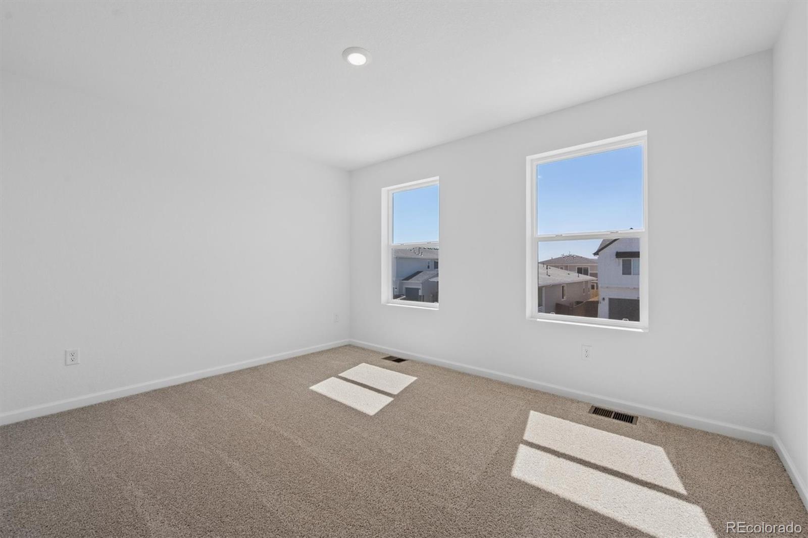 45935 Gentry Avenue Bennett, CO 80102 - Photo 17 of 22 an empty room with windows