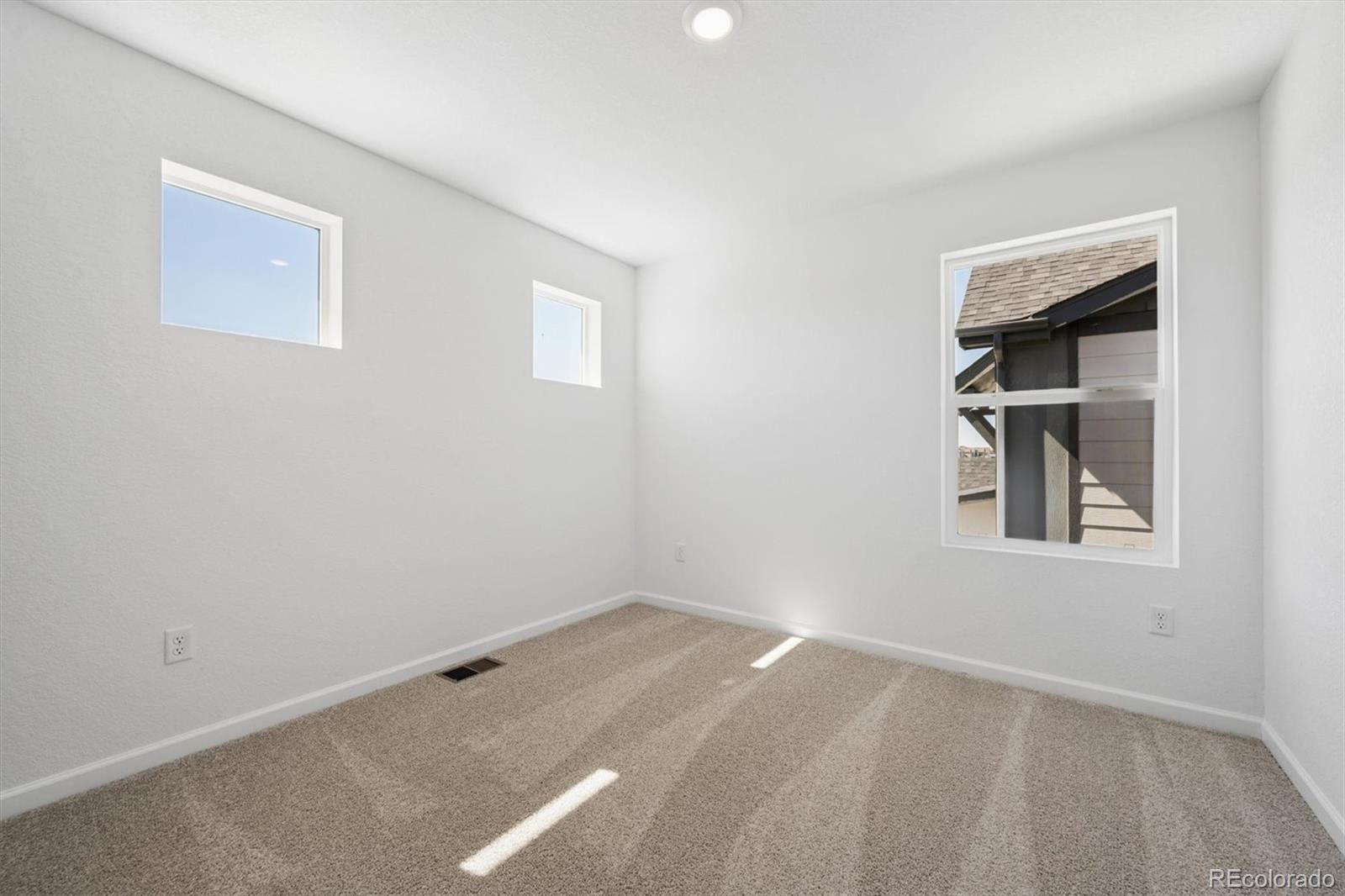 45935 Gentry Avenue Bennett, CO 80102 - Photo 18 of 22 an empty room with a window