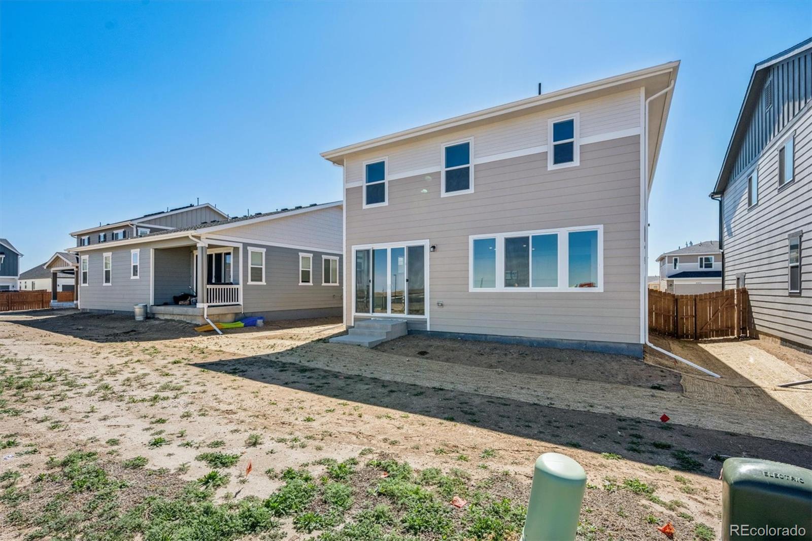 45935 Gentry Avenue Bennett, CO 80102 - Photo 20 of 22 a front view of a house with a yard