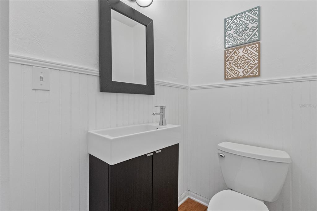 1603 Tulane Street Orlando, FL 32804 - Photo 19 of 27 a bathroom with a sink vanity mirror and toilet