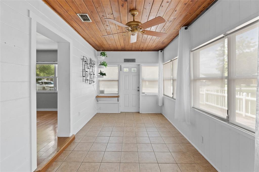 1603 Tulane Street Orlando, FL 32804 - Photo 4 of 27 a view of a livingroom with a window and kitchen view