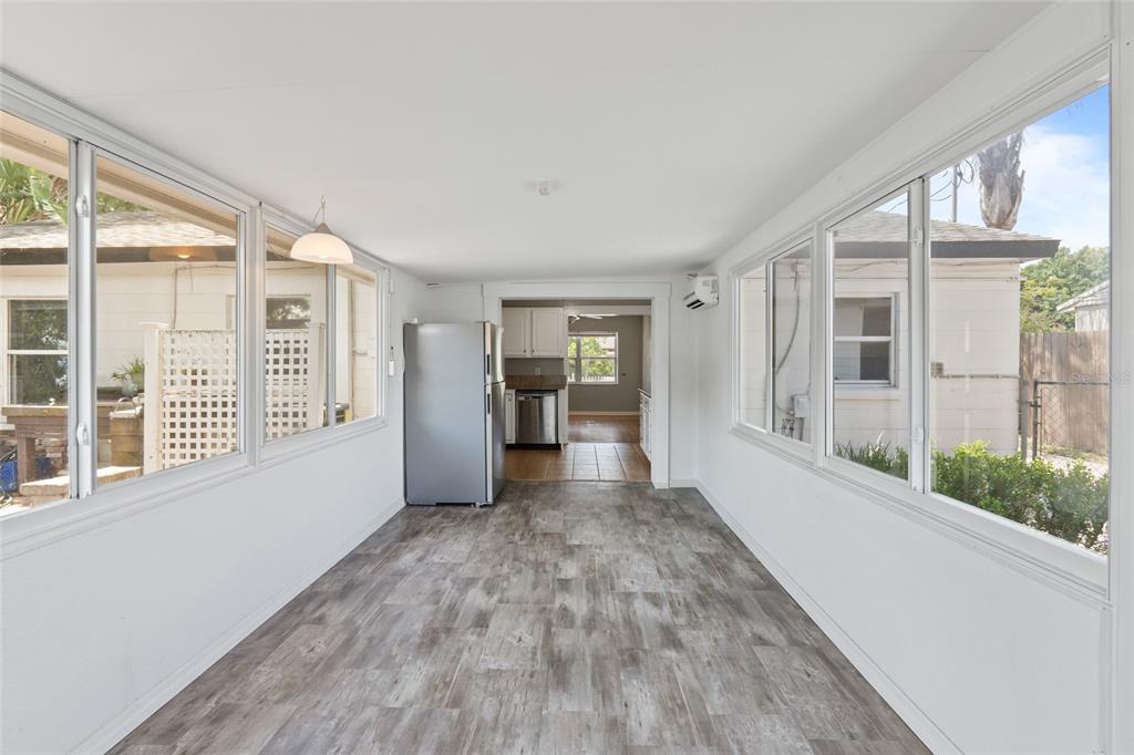 1603 Tulane Street Orlando, FL 32804 - Photo 8 of 27 a view of an empty room with wooden floor and a window
