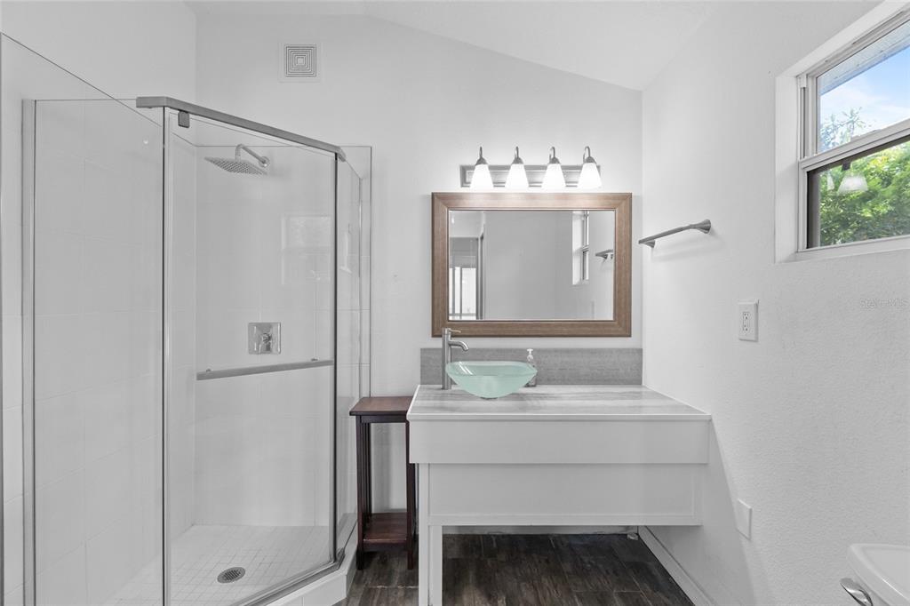 1603 Tulane Street Orlando, FL 32804 - Photo 10 of 27 a bathroom with a sink vanity and a mirror