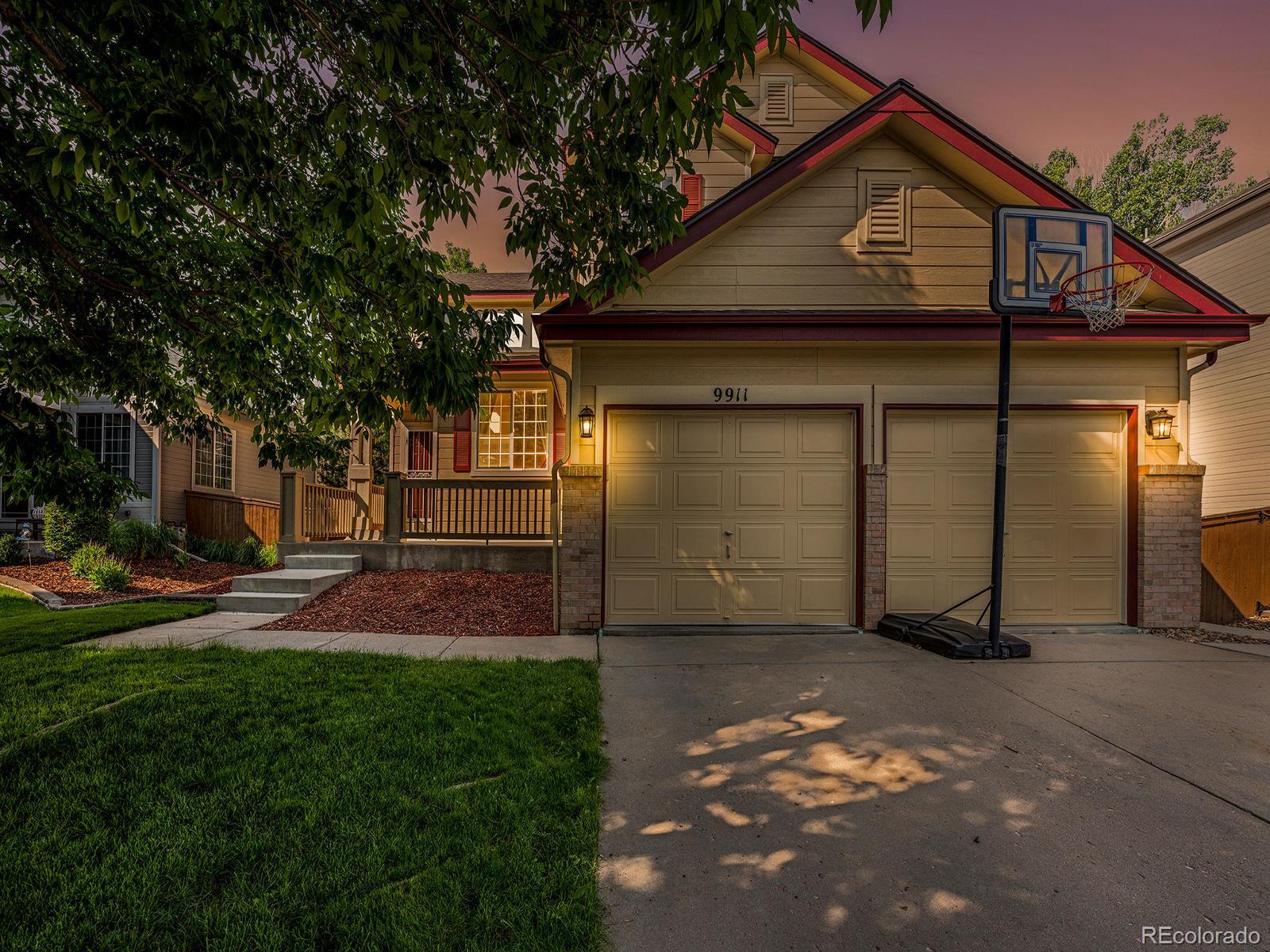 9911 Sylvestor Road Highlands Ranch, CO 80129 - Photo 1 of 31 a backyard of a house with lots of green space