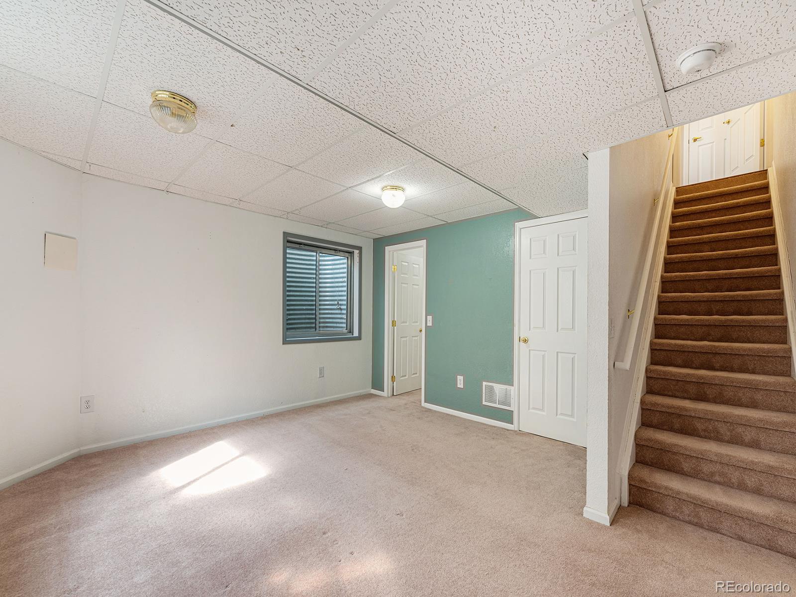 9911 Sylvestor Road Highlands Ranch, CO 80129 - Photo 17 of 31 a view of an empty room with a window