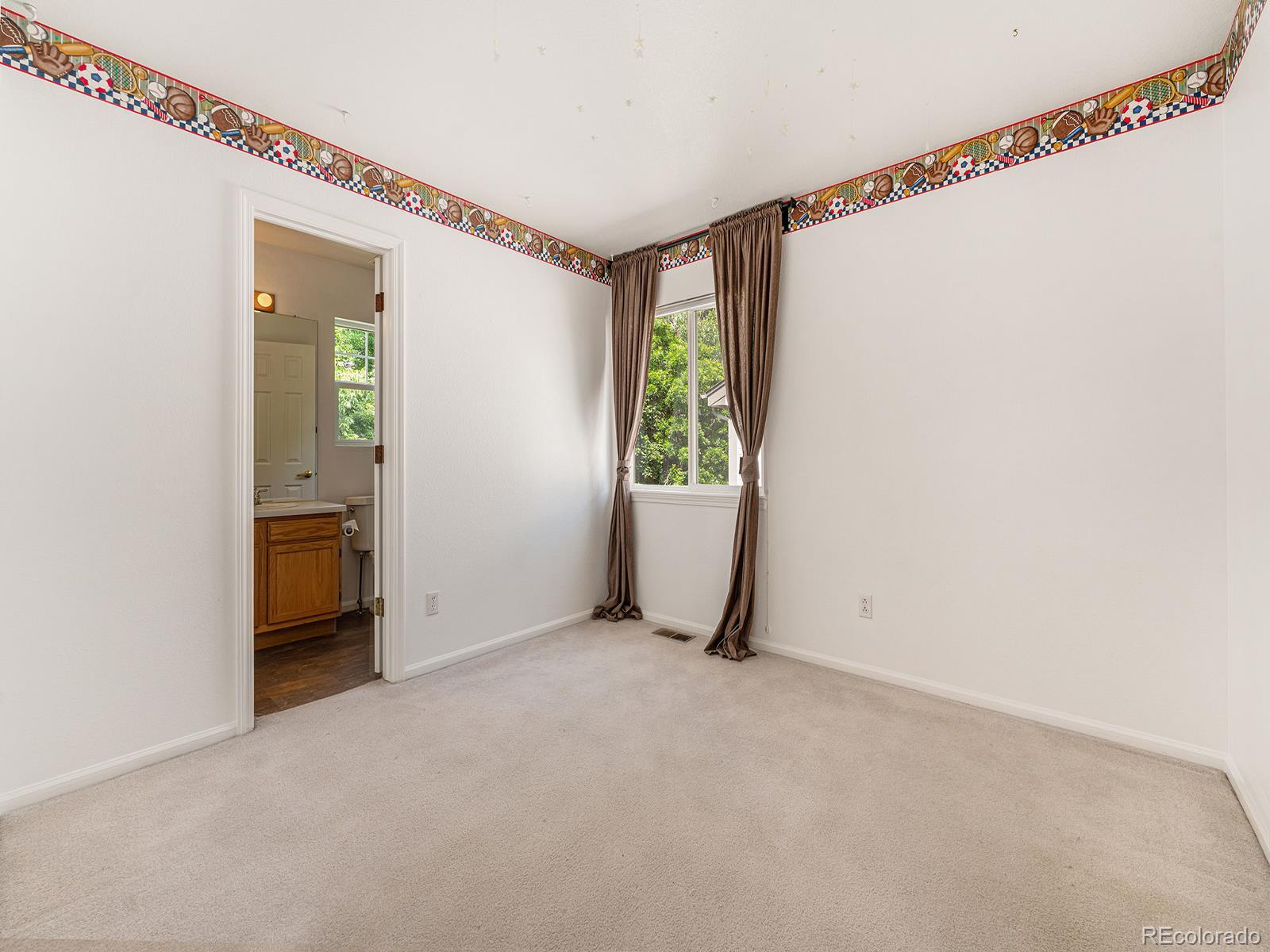 9911 Sylvestor Road Highlands Ranch, CO 80129 - Photo 20 of 31 a view of an empty room with a window