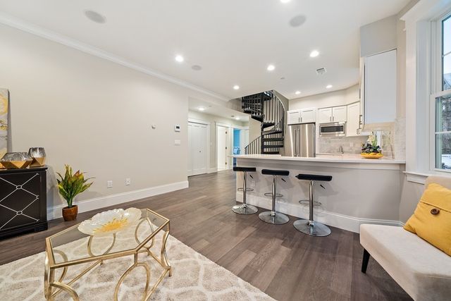 a room with wooden floor and furniture