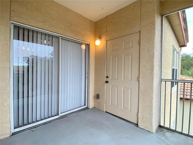 a view of a hallway with entryway door