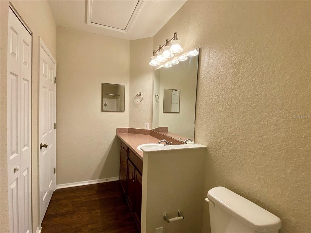 823 Camargo Way, Unit 302 Altamonte Springs, FL 32714 - Photo 10 of 19 a bathroom with a toilet sink and mirror