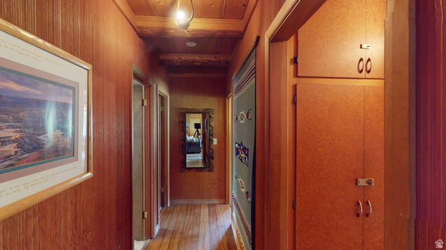 315 Abbey Road Moab, UT 84532 - Photo 21 of 46 Hall with wood ceiling, wood walls, and light wood-type flooring