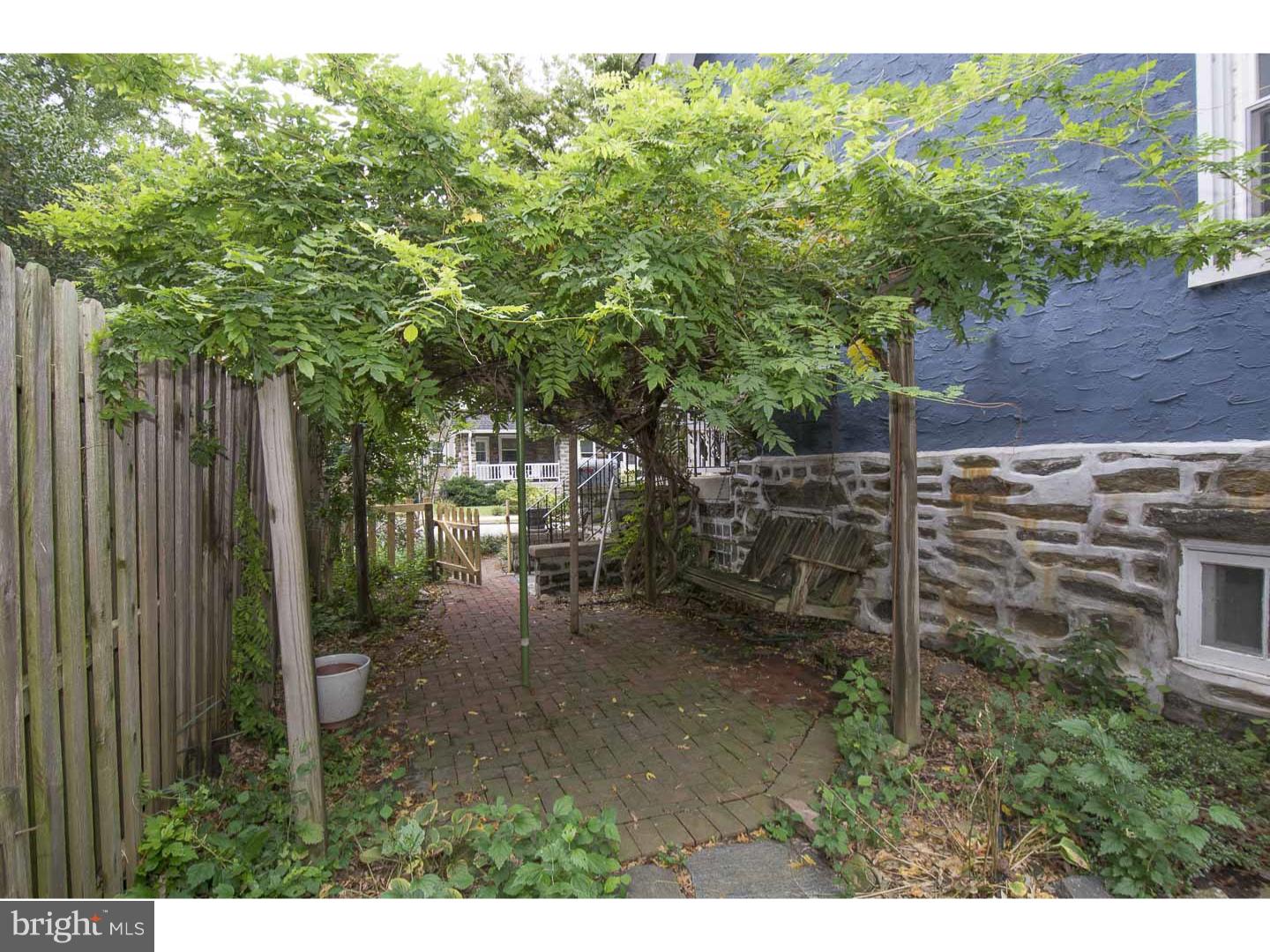 129 Kenilworth Road Merion Station, PA 19066 - Photo 22 of 22 a backyard of a house with table and chairs