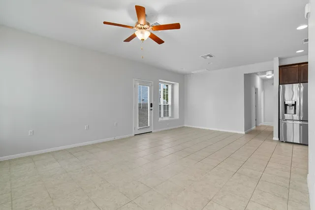 a view of livingroom with hardwood floor and a ceiling fan