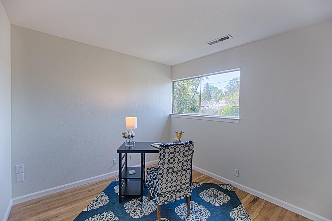 716 Rosedale Avenue Capitola, CA 95010 - Photo 12 of 19 a bedroom with a bed and a window
