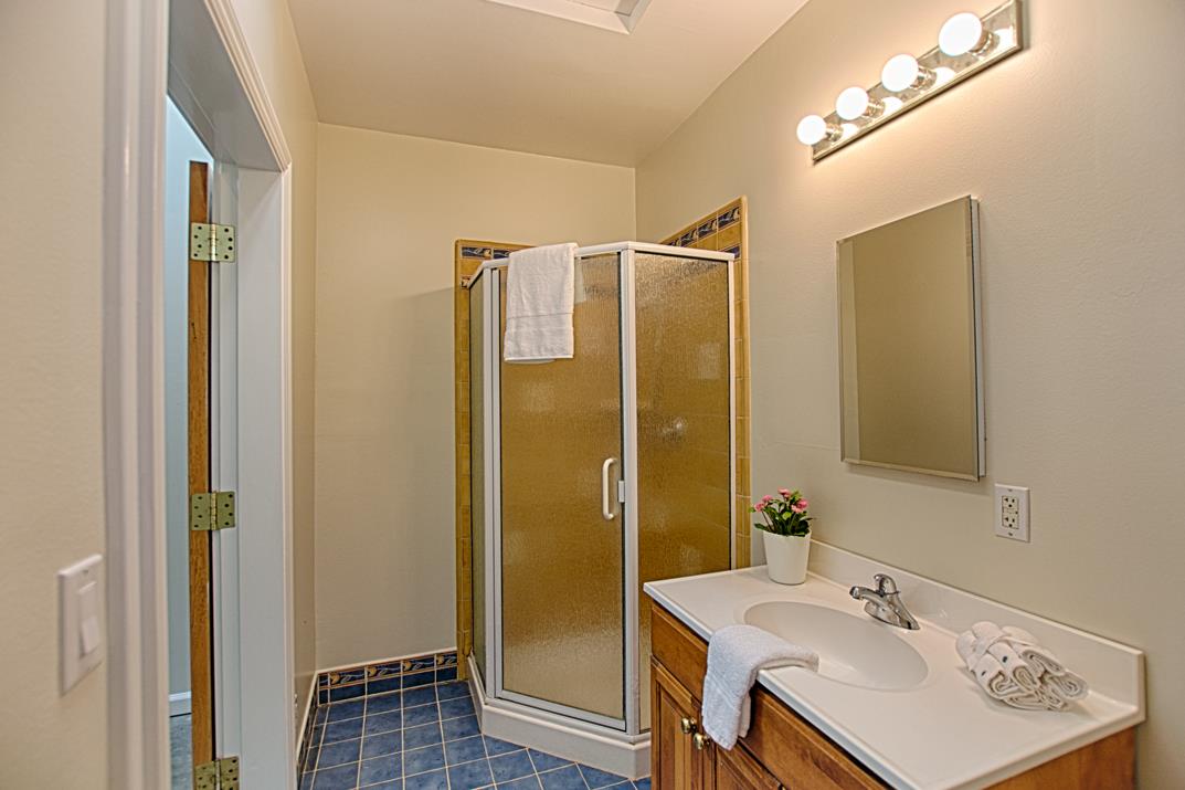 716 Rosedale Avenue Capitola, CA 95010 - Photo 14 of 19 a bathroom with a sink a mirror and a shower