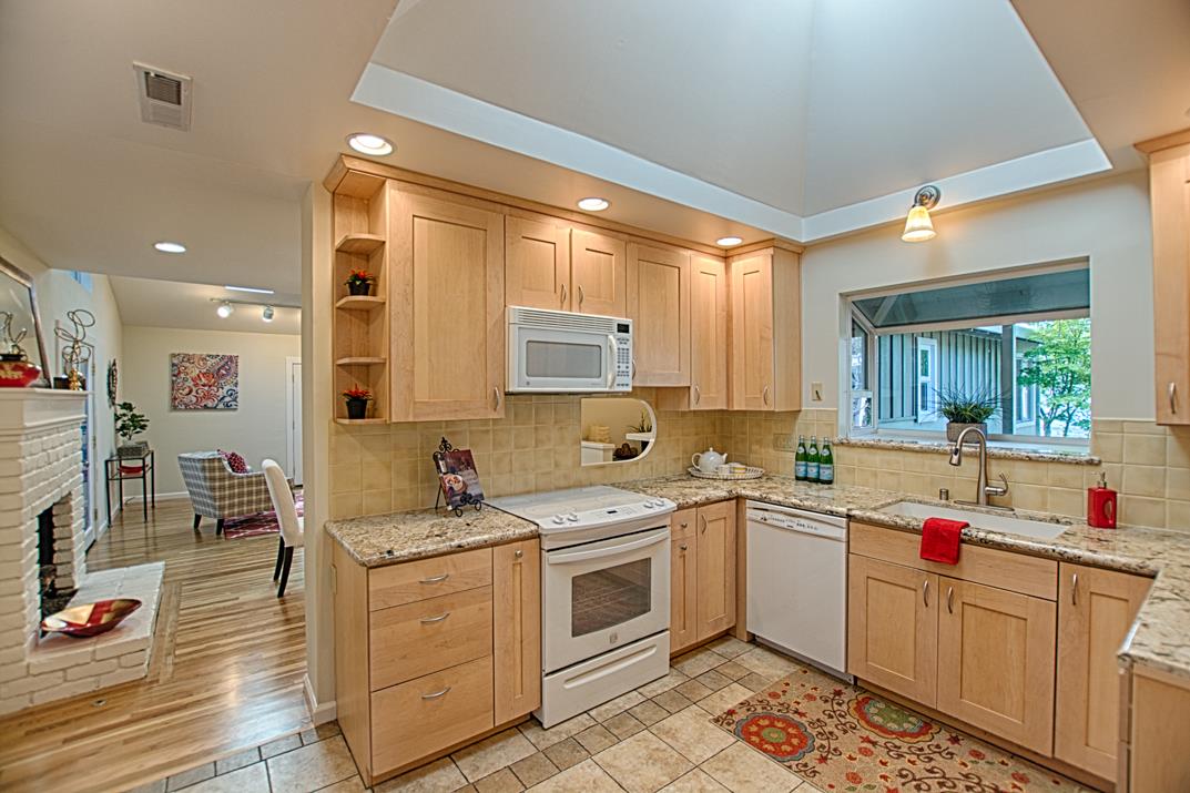 716 Rosedale Avenue Capitola, CA 95010 - Photo 6 of 19 a kitchen with a sink stove and cabinets