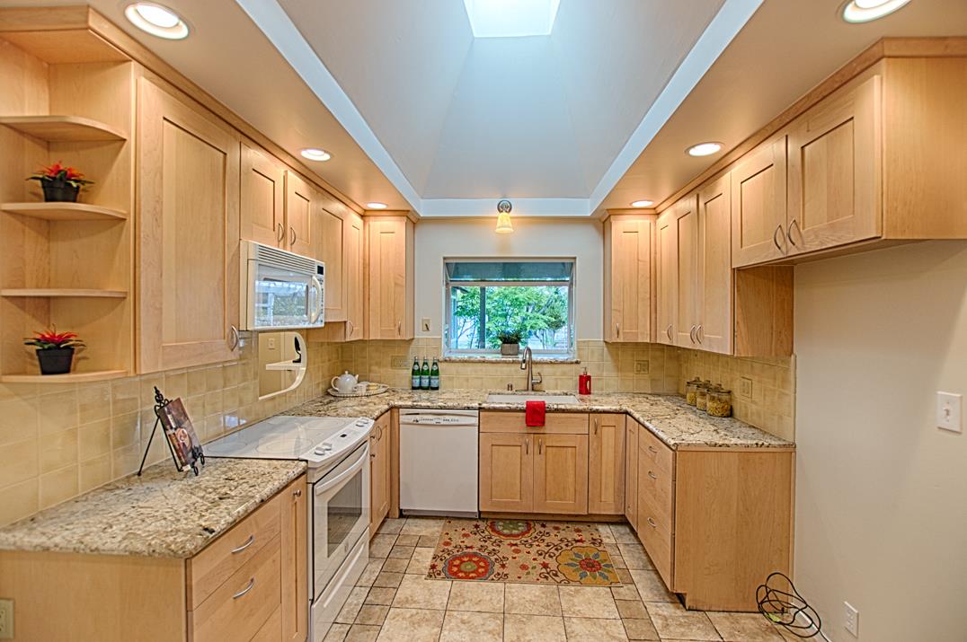 716 Rosedale Avenue Capitola, CA 95010 - Photo 7 of 19 a kitchen with a sink stove and cabinets