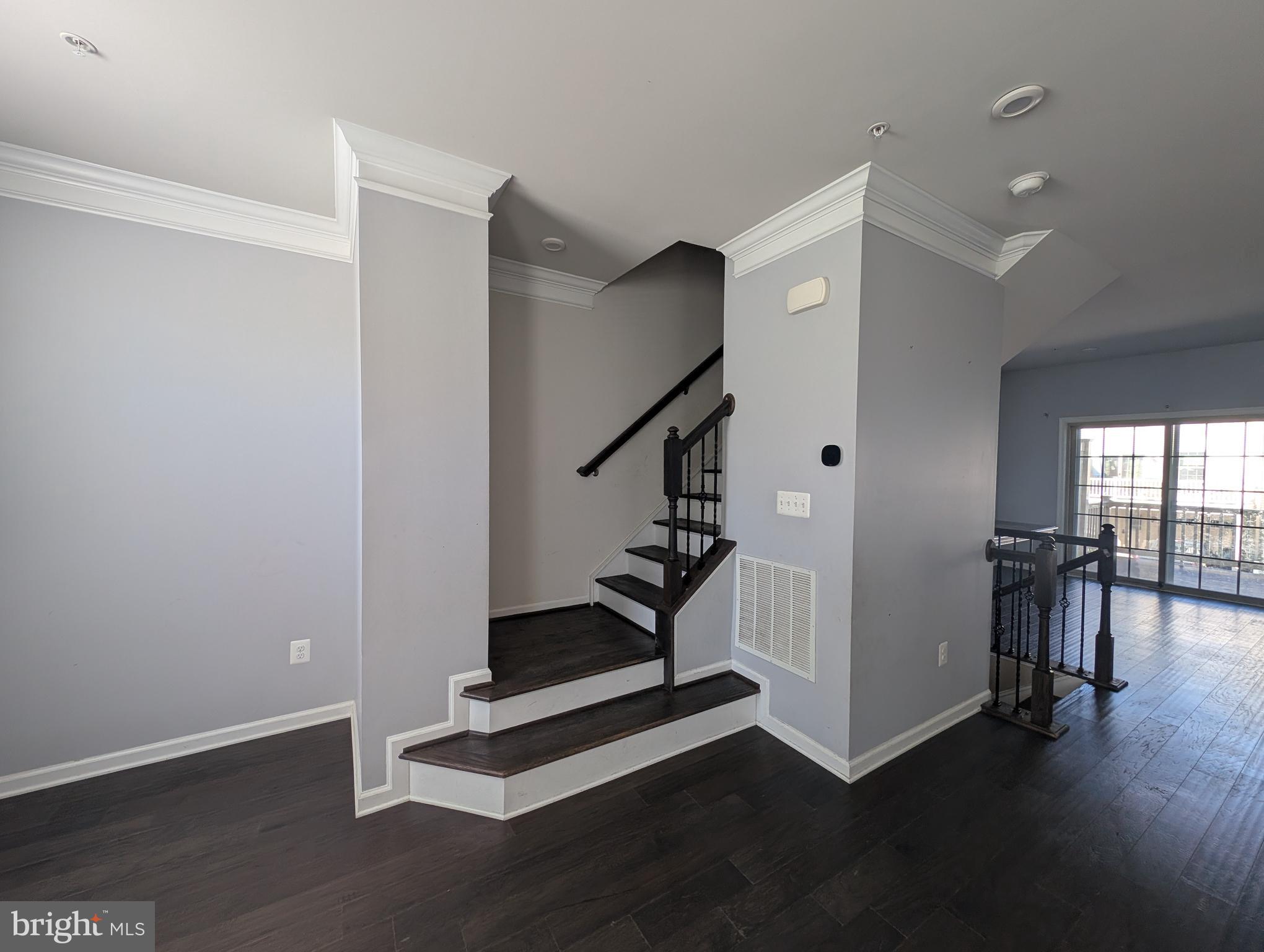 10018 Sandy Run Road Middle River, MD 21220 - Photo 4 of 17 a view of entryway with stairs and wooden floor