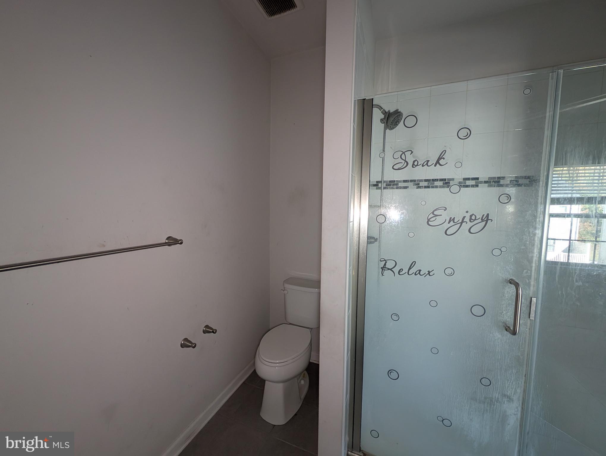 10018 Sandy Run Road Middle River, MD 21220 - Photo 10 of 17 a bathroom with a toilet and a shower