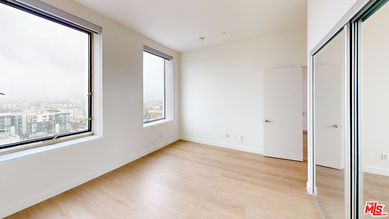 3810 Wilshire Boulevard, Unit 1108 Los Angeles, CA 90010 - Photo 13 of 15 a view of an empty room with a window