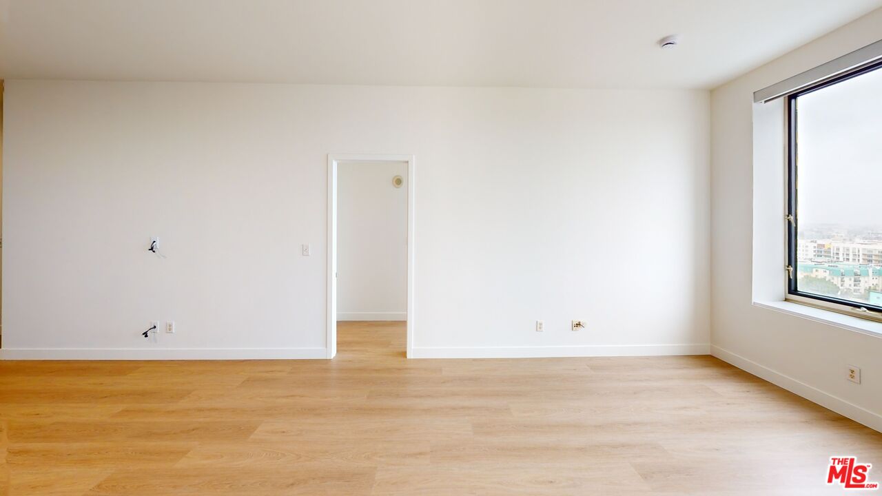 3810 Wilshire Boulevard, Unit 1108 Los Angeles, CA 90010 - Photo 10 of 15 a view of an empty room