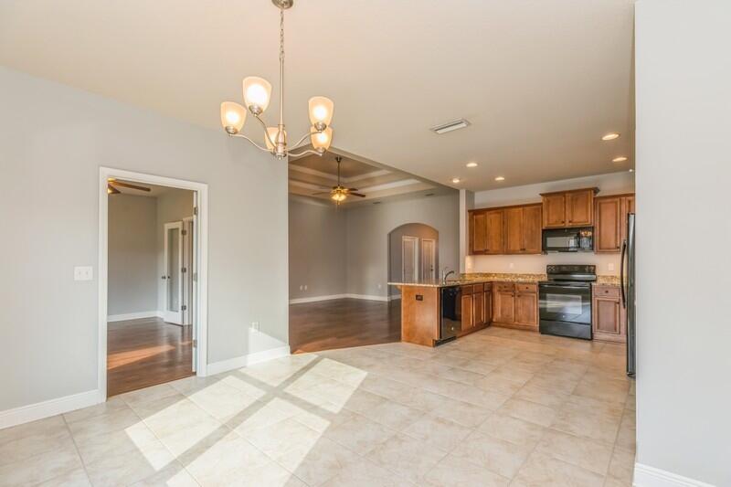 169 Windchime Way Freeport, FL 32439 - Photo 14 of 67 a view of kitchen with sink refrigerator and microwave