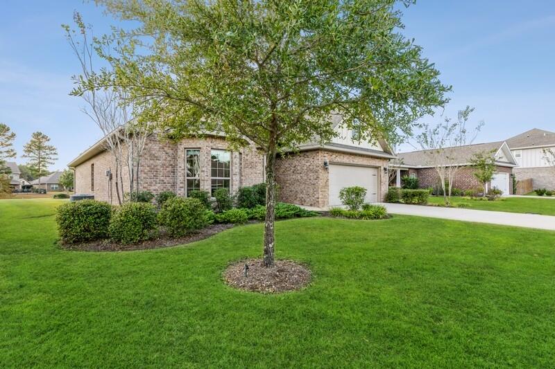 169 Windchime Way Freeport, FL 32439 - Photo 3 of 67 a view of a house with backyard and garden