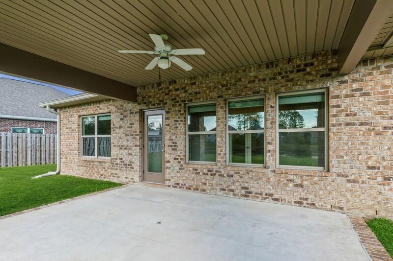 169 Windchime Way Freeport, FL 32439 - Photo 39 of 67 a front view of a house with a garden