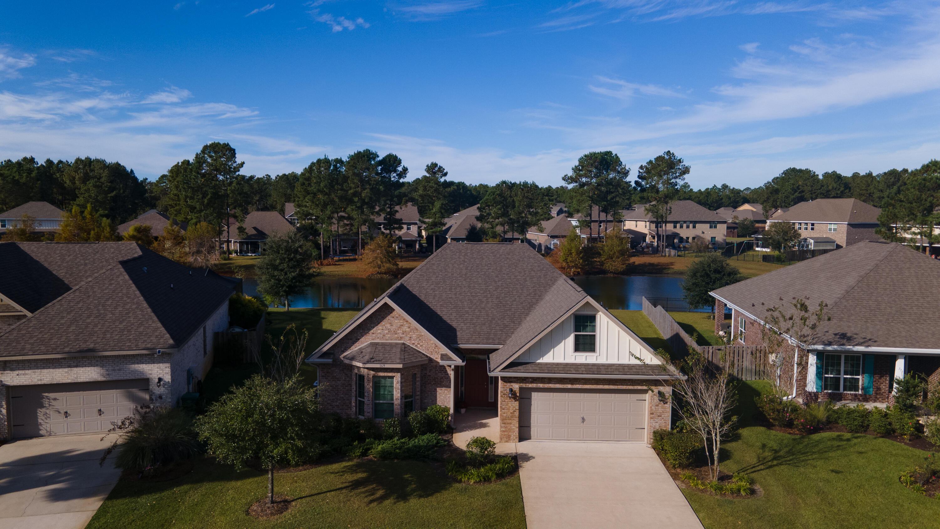 169 Windchime Way Freeport, FL 32439 - Photo 46 of 67 a aerial view of a house with a big yard plants and large tree