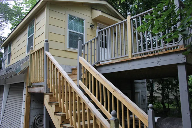 a view of wooden house with a large door