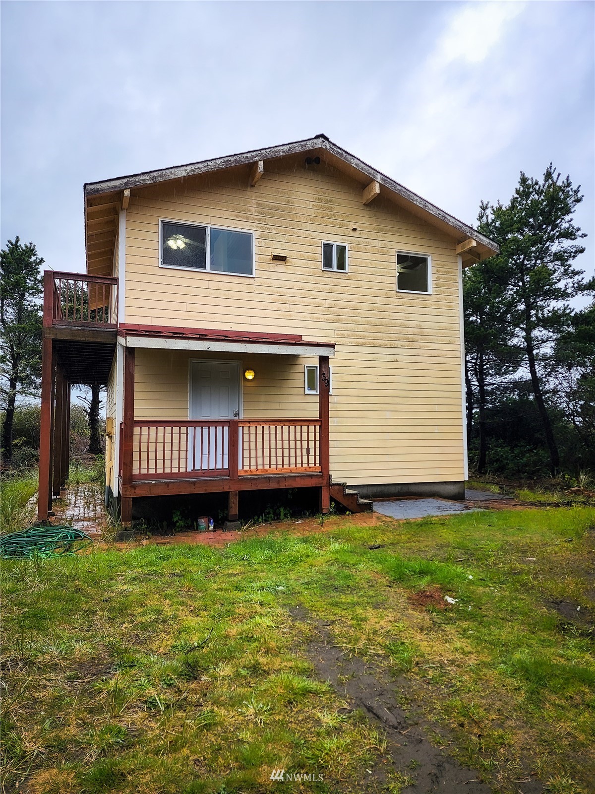 39 Ocean Lane Copalis Beach, WA 98535 - Photo 4 of 21 a view of a house with a yard and a yard