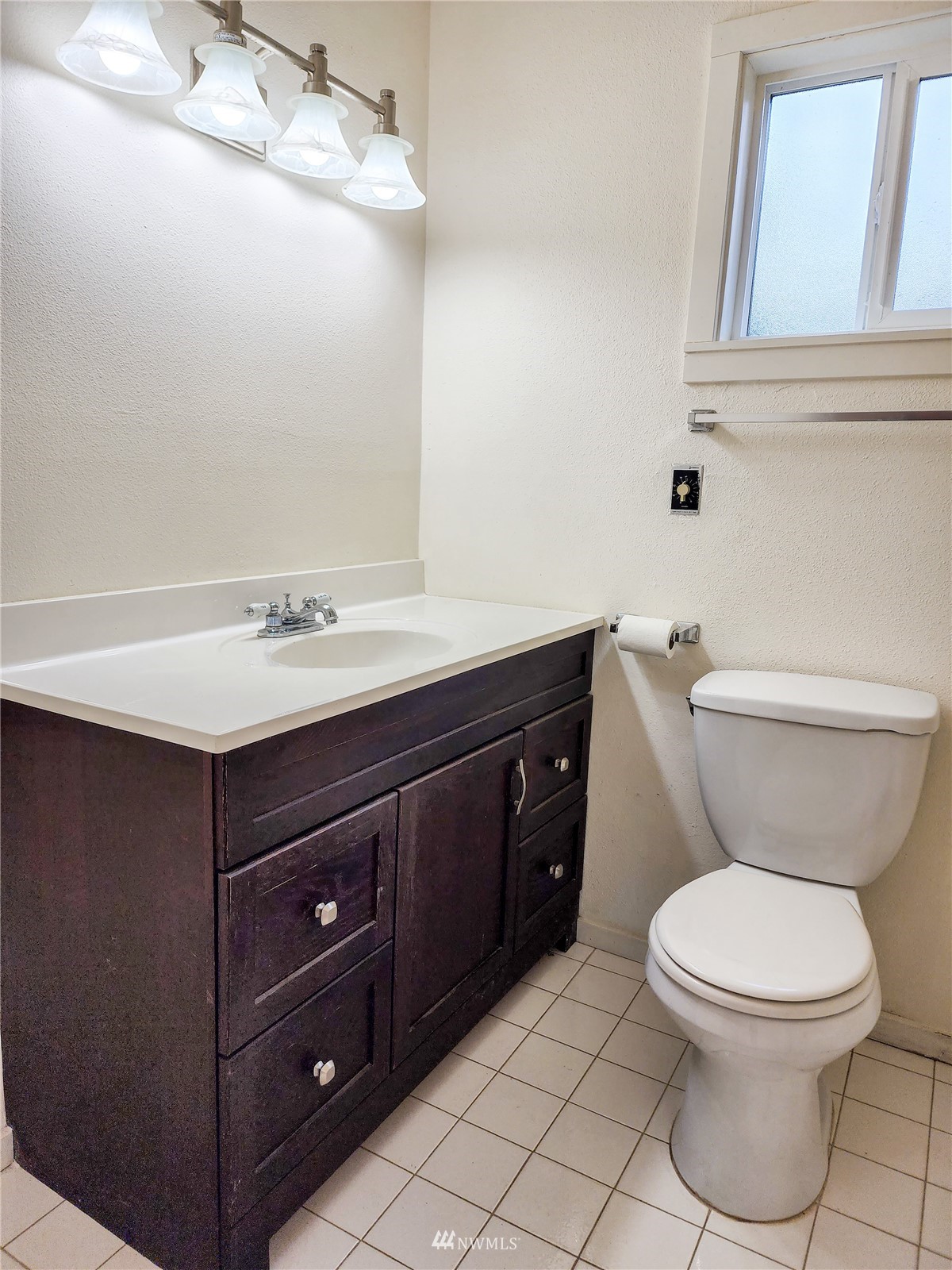 39 Ocean Lane Copalis Beach, WA 98535 - Photo 10 of 21 a bathroom with a toilet sink vanity and mirror