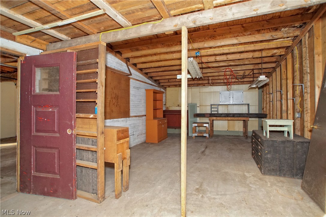 8063 Middlesex Road Mentor, OH 44060 - Photo 24 of 35 The 3rd bay can be storage, workshop, etc. The entire garage received a reroof in October 2022.