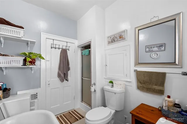 a white toilet sitting next to a bathroom sink